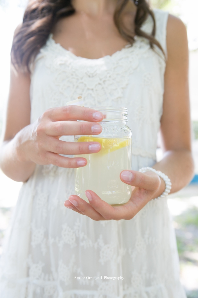 Bridesmaid with lemonade in mason jar