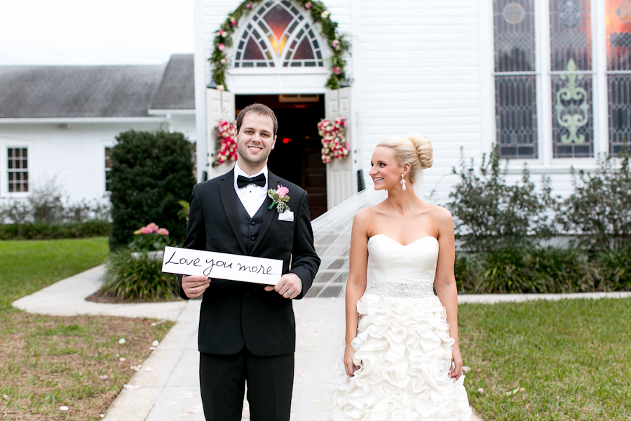 bride and groom I love you more sign