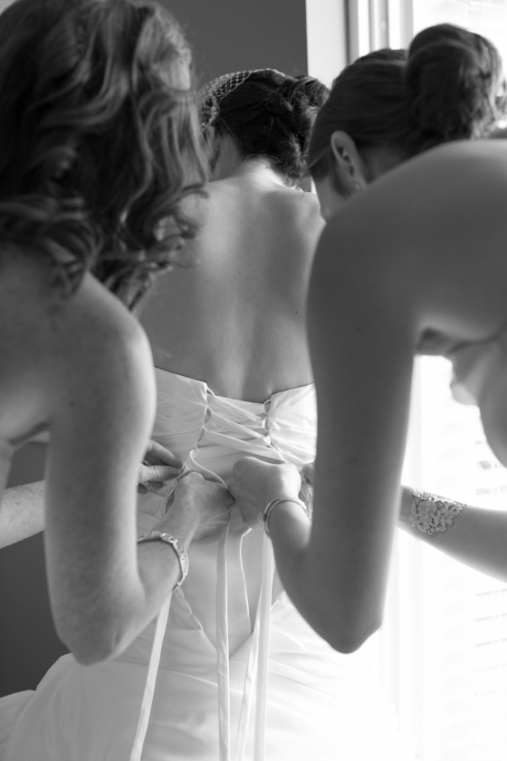 Florida beach wedding  bride putting on dress