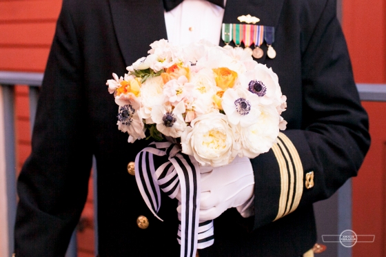 military groom holding bouquet